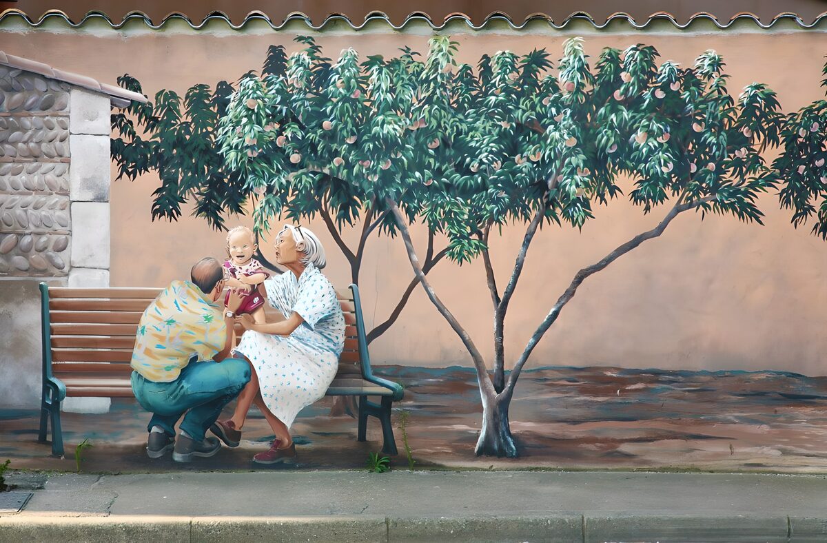 Family mural beneath a fruit tree
