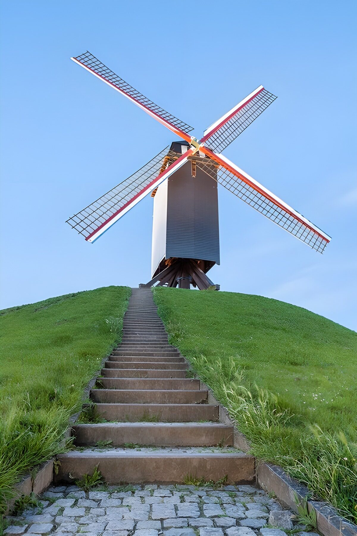 Steps to a windmill on a green hill