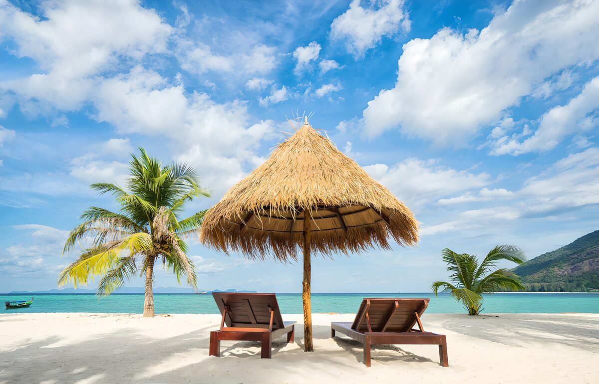 Two sun loungers in tropical shade