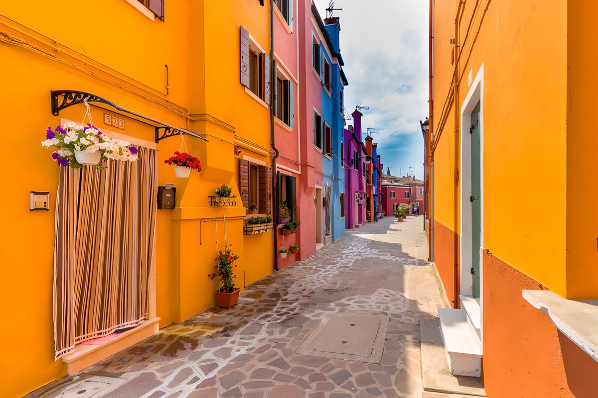Sunlit street of brightly coloured houses