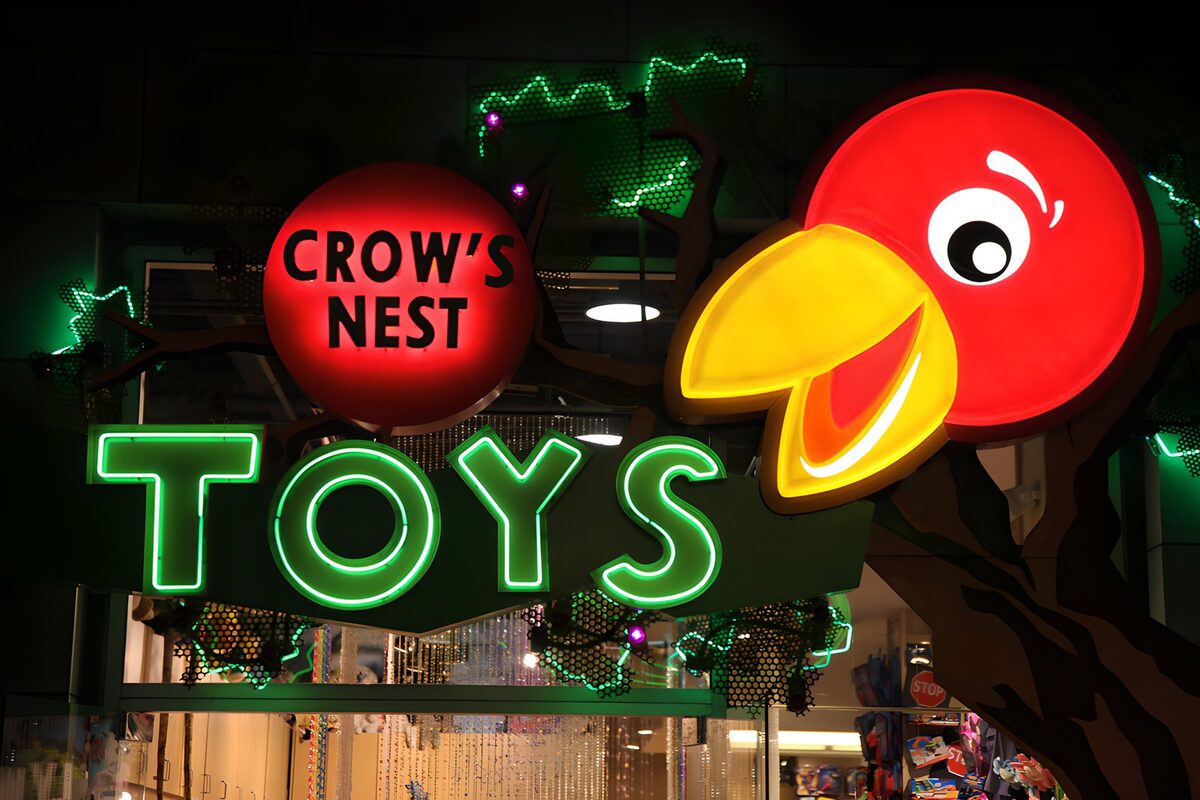 Red bird above a glowing toy sign