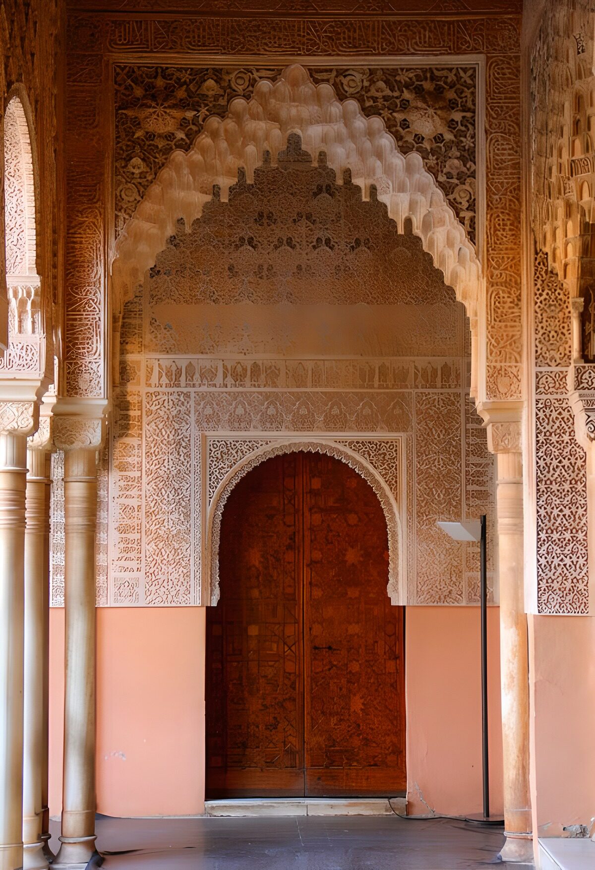 Dark wooden doors beneath ornate arches