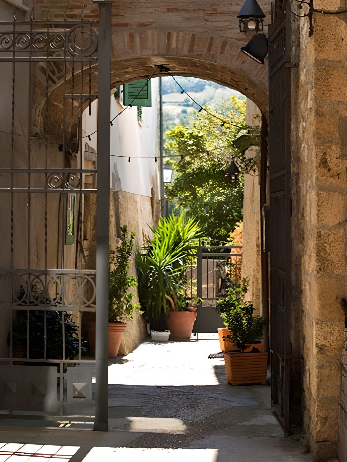 Stone arch framing a sunlit passage