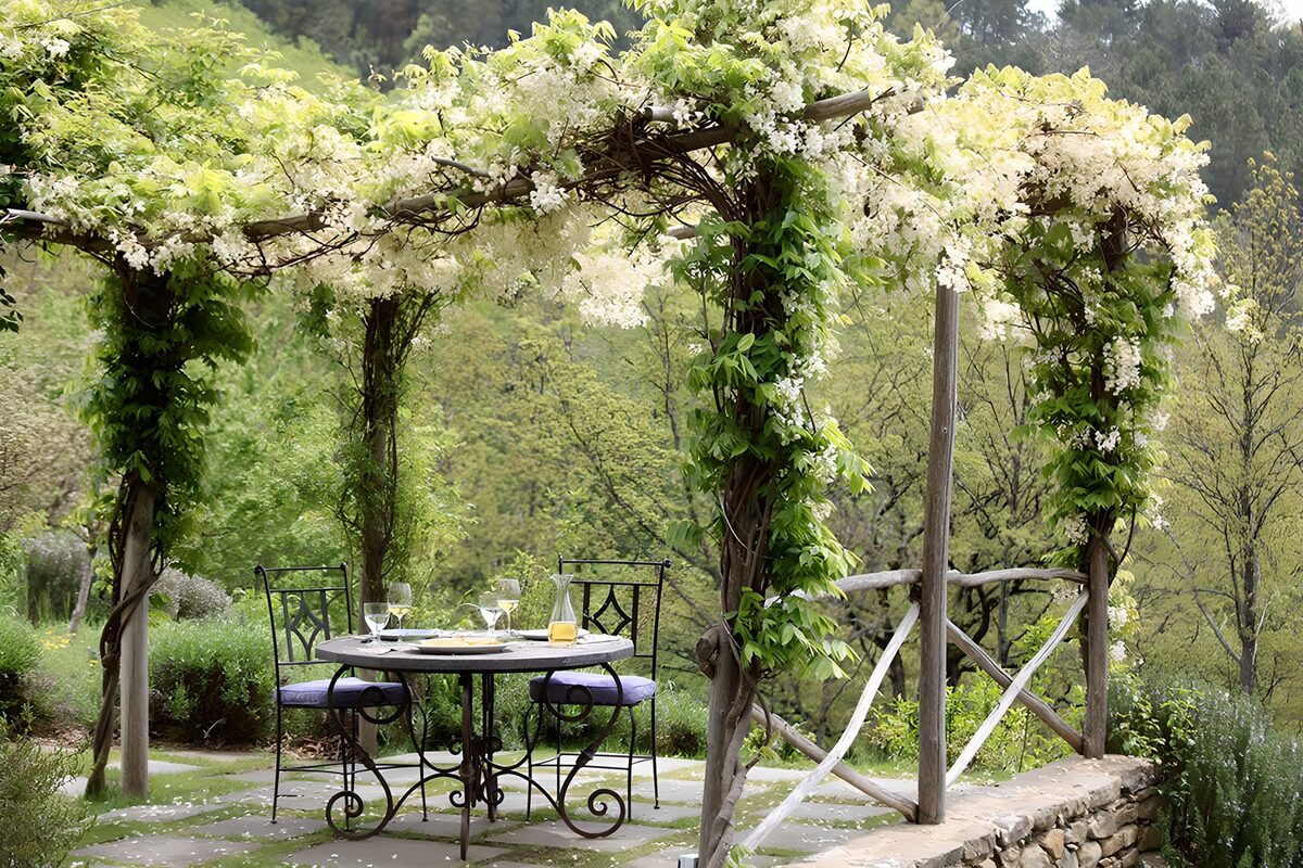 Table for two beneath a flowering pergola