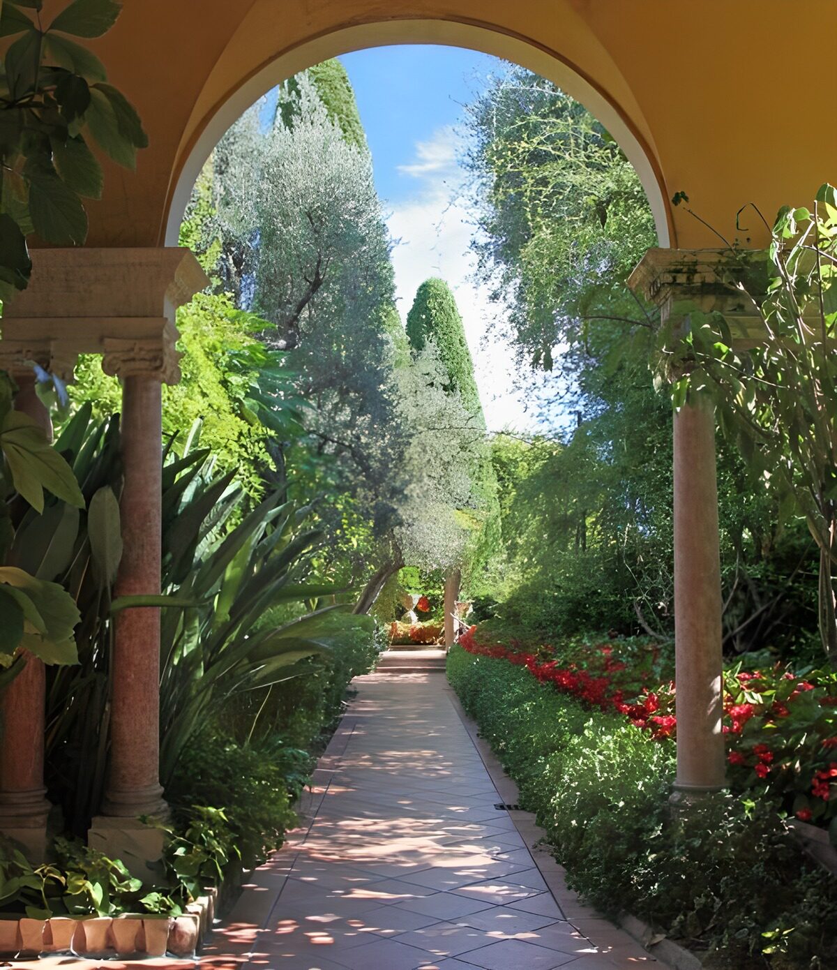 Shaded arch, sunlit garden path