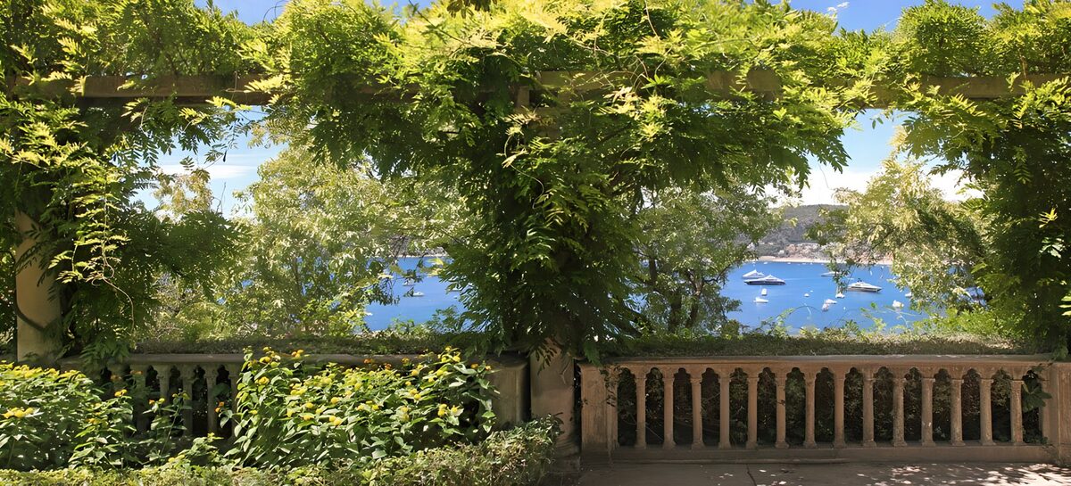 Garden terrace overlooking a blue bay