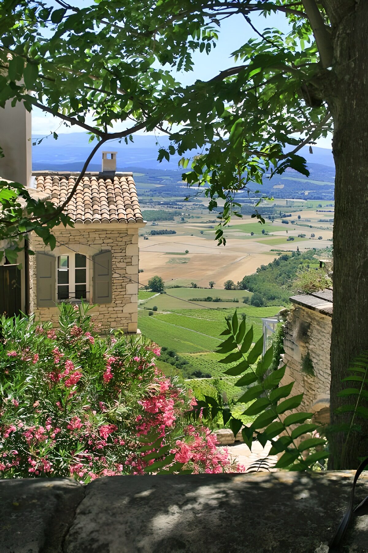 Stone house above a sunlit valley