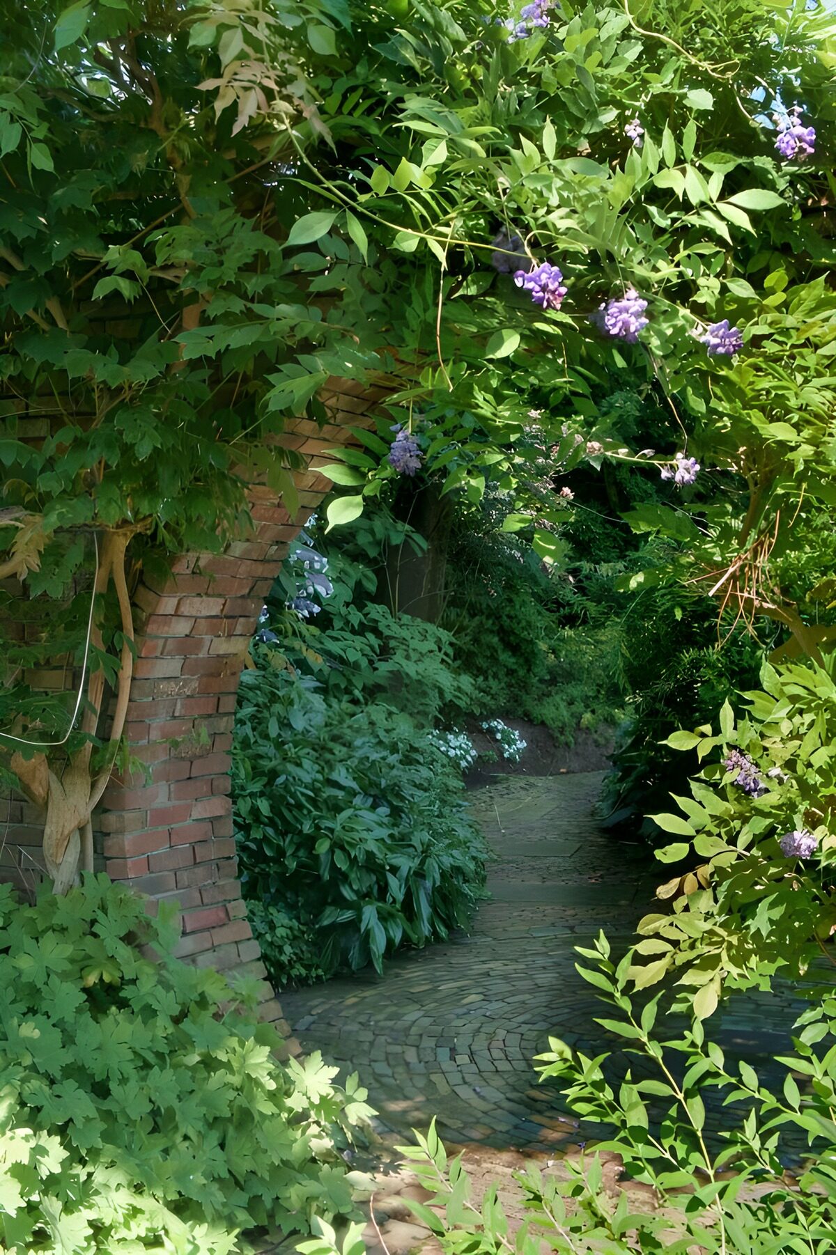 Brick arch and a quiet garden path