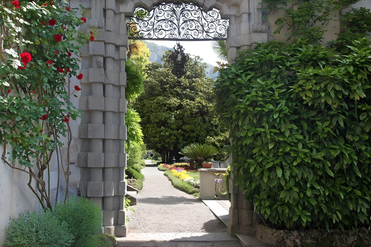 Stone arch to a sunlit garden