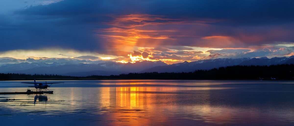 Seaplane on a lake at sunset