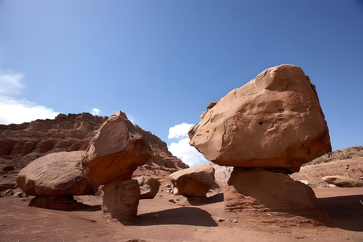 Sunlit balancing rocks under blue skies