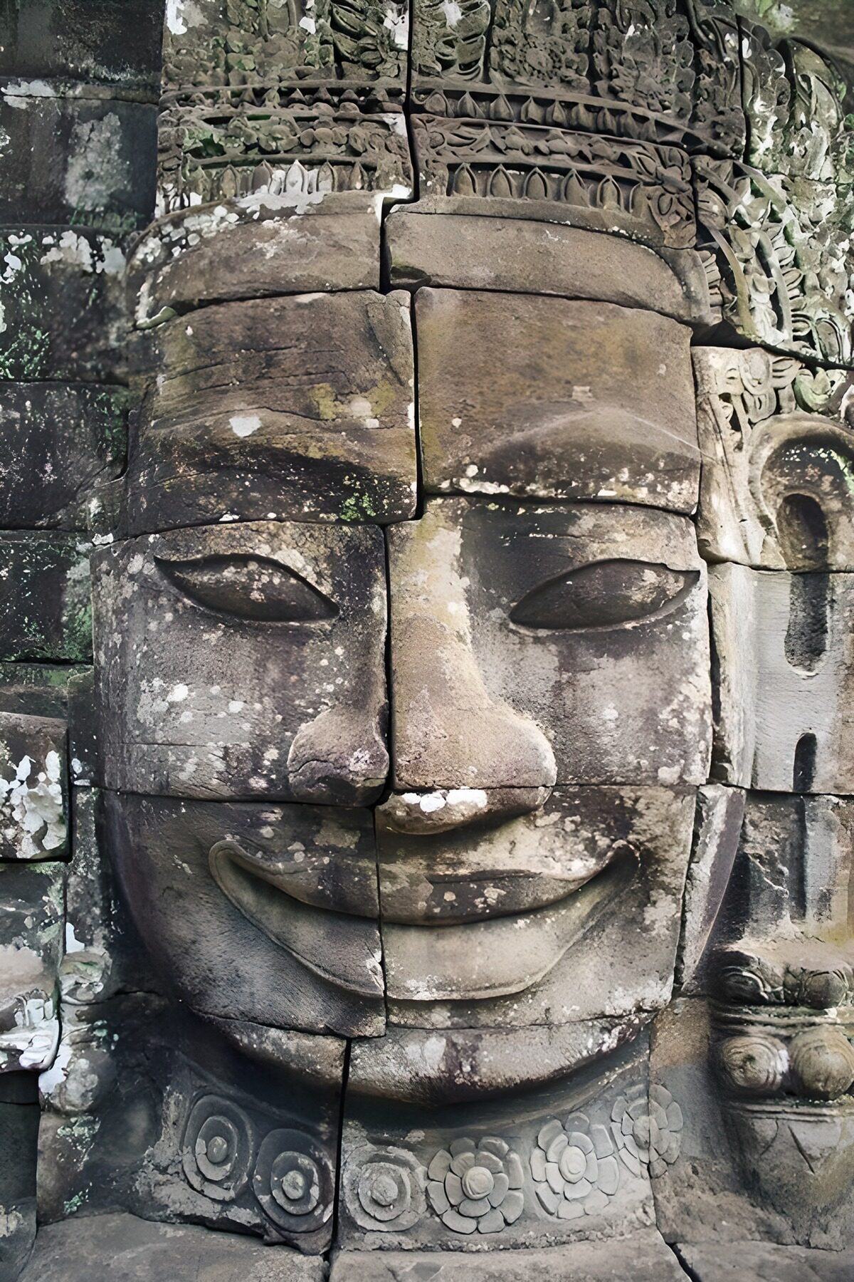 Smiling face carved in weathered stone