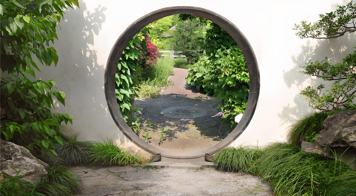 Round garden gateway in dappled light