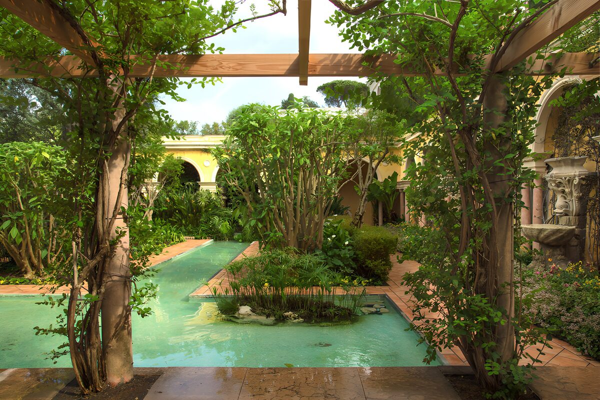 Turquoise channels beneath a leafy pergola