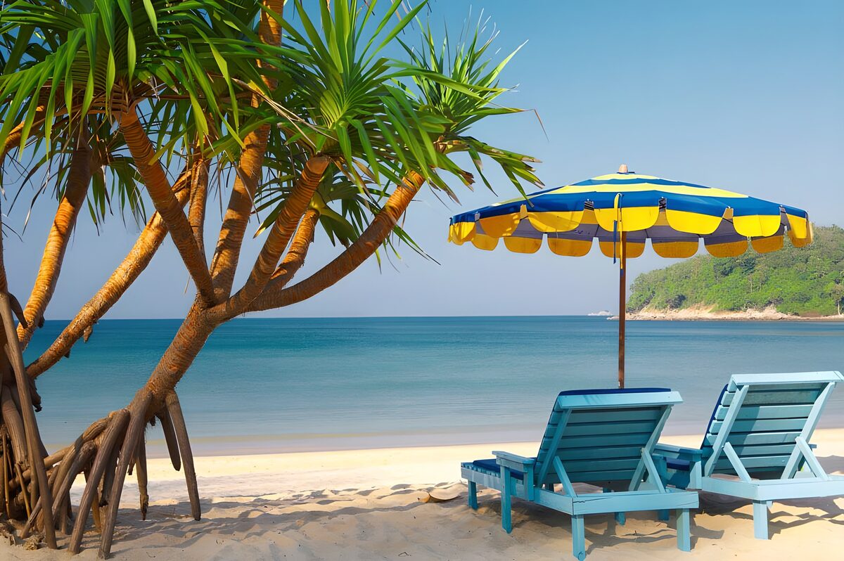 Two blue loungers by a turquoise sea