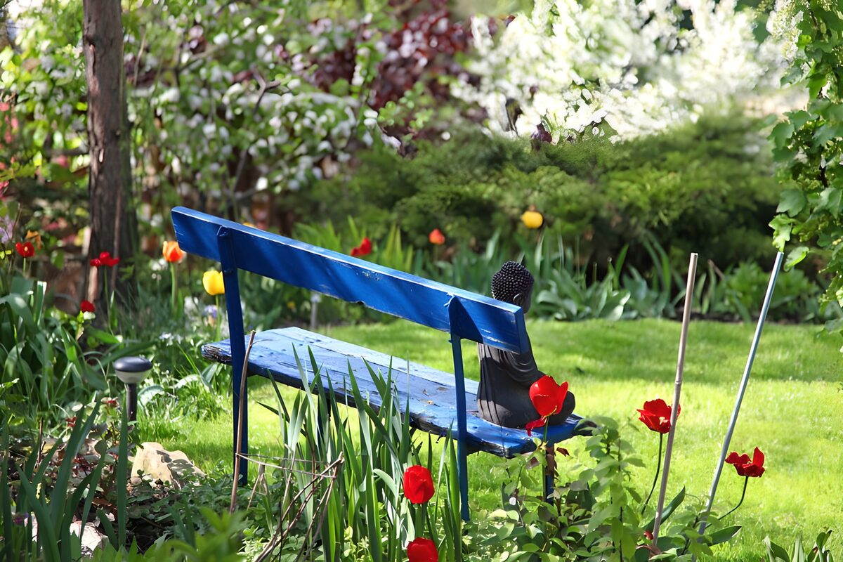 Blue bench and tulips in dappled light