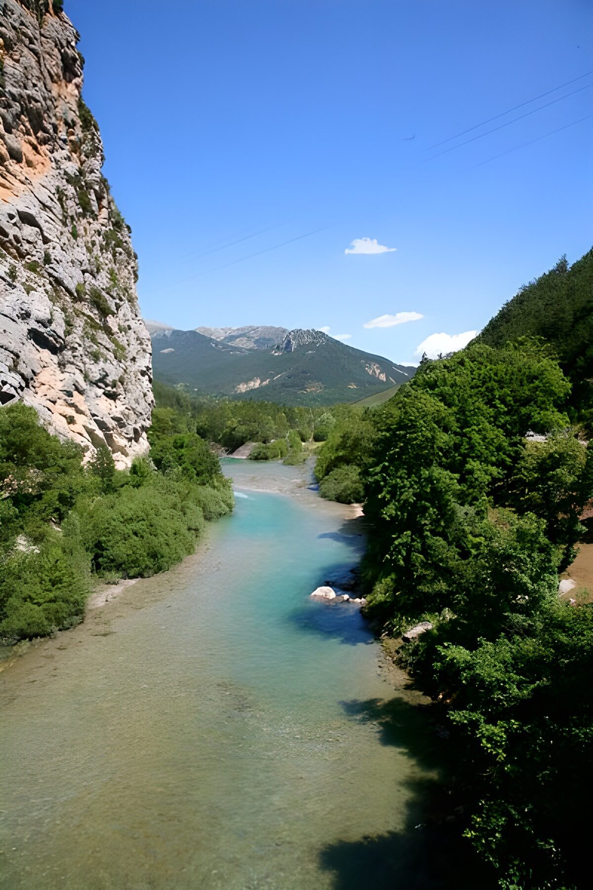 Turquoise river in a sunlit mountain valley