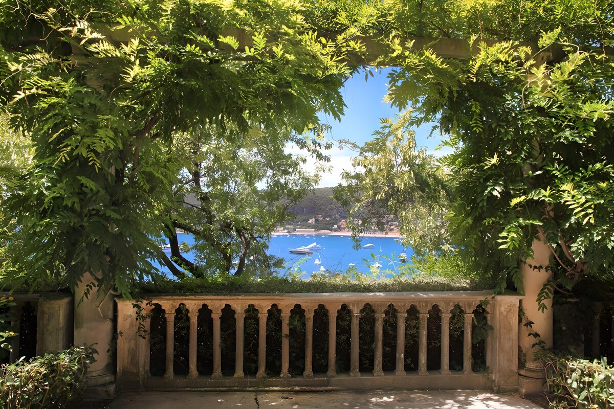 Shaded terrace above a blue bay