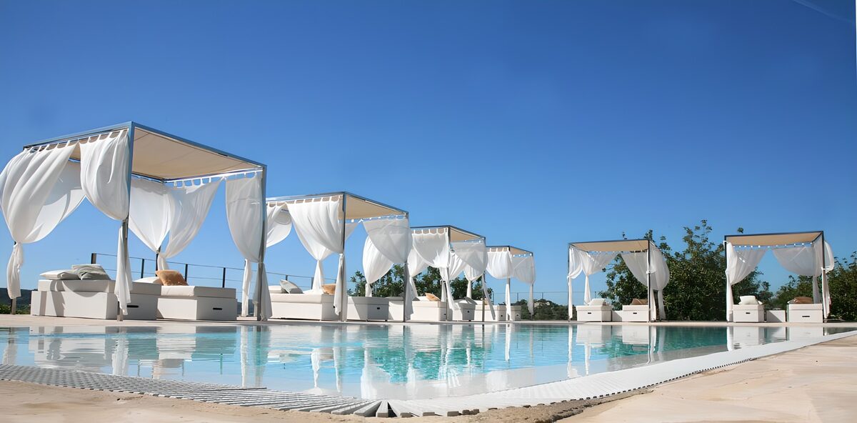 White poolside cabanas in the sunshine