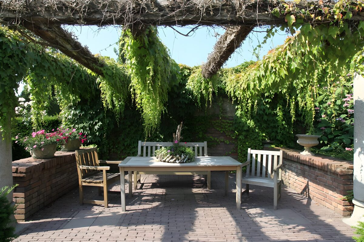 Garden table in dappled pergola shade