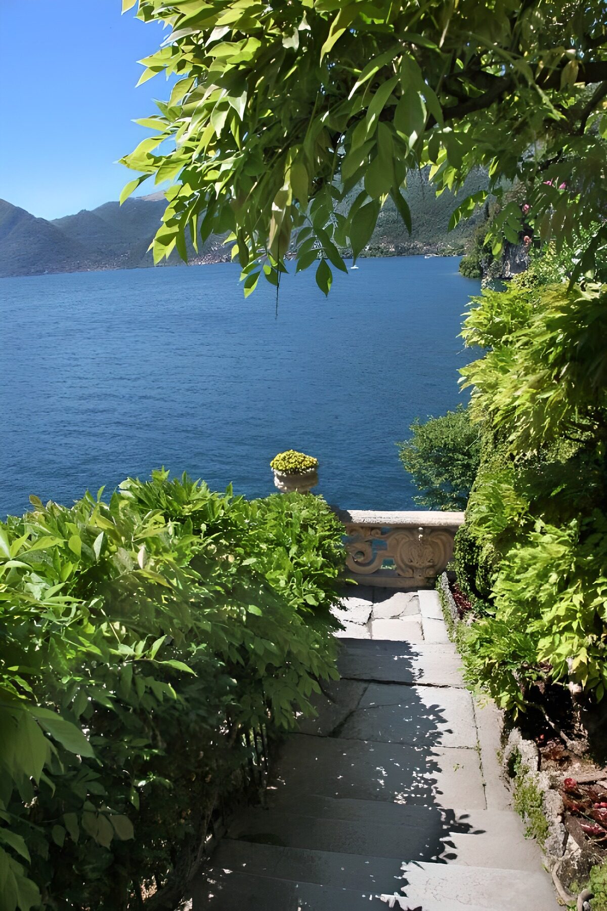 Sunlit stone steps above blue water
