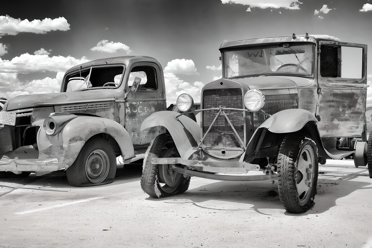 Two weathered lorries in black and white