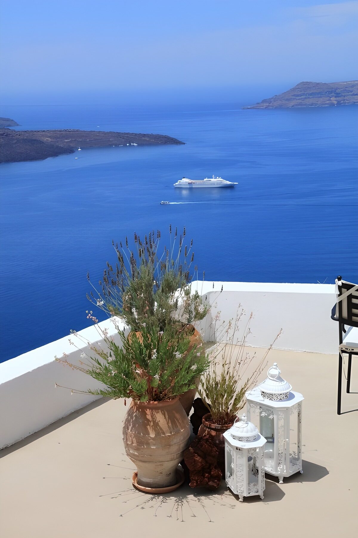Sunlit terrace overlooking a blue bay
