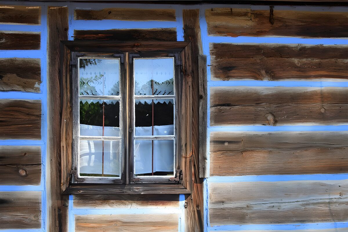 Rustic window with lace curtains