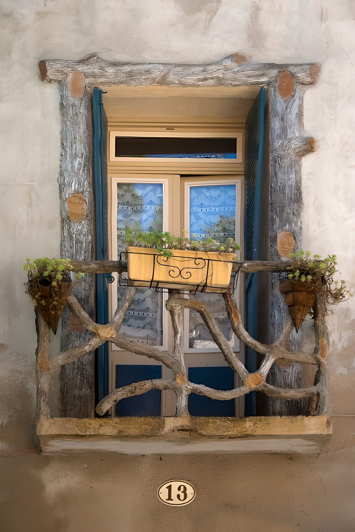 Blue shutters and a timeworn balcony