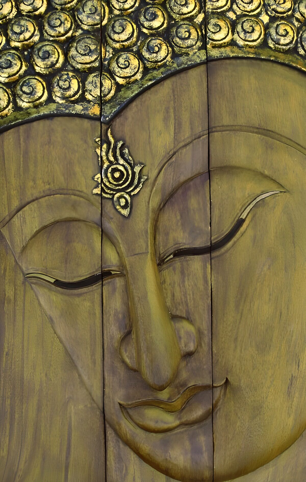 Carved wooden Buddha in muted gold