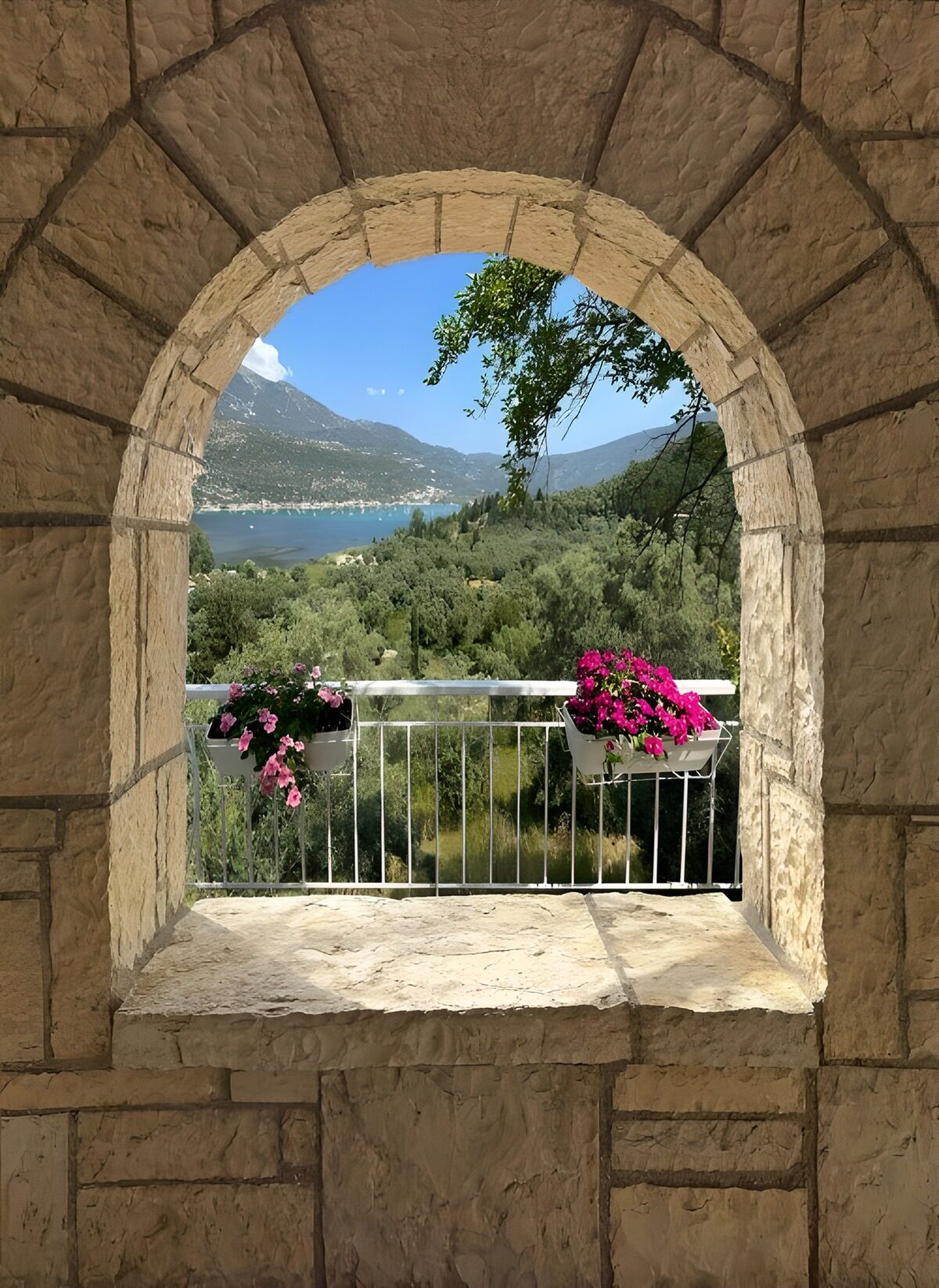 Lake and mountains through a sunlit arch