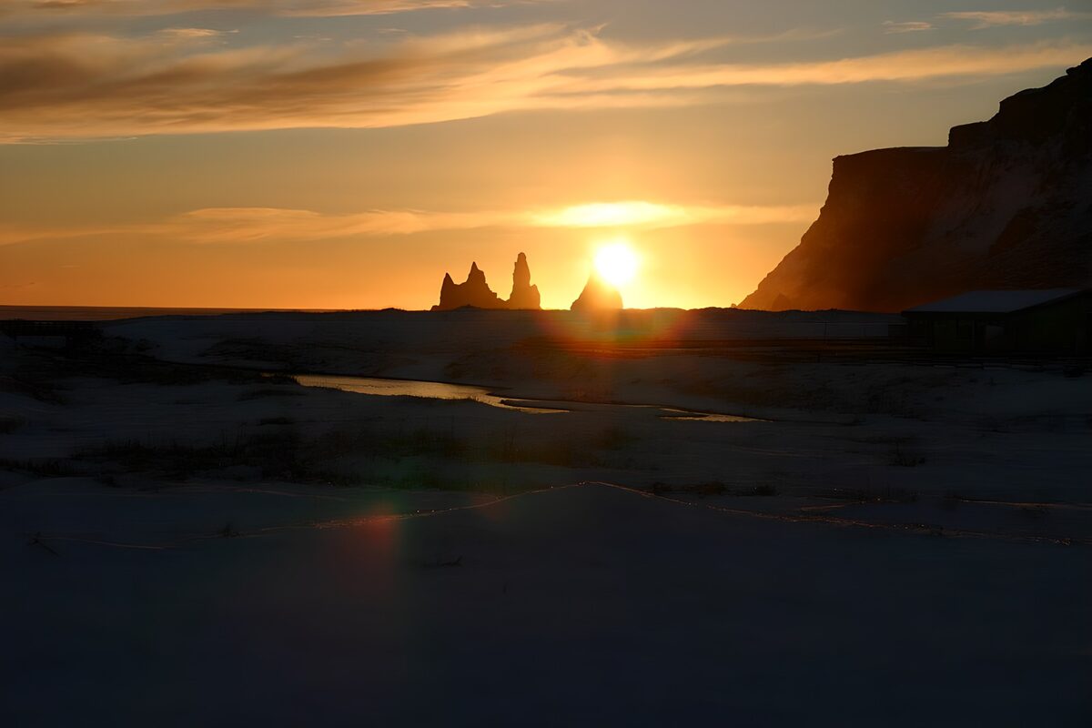 Low sun over a snowy coast