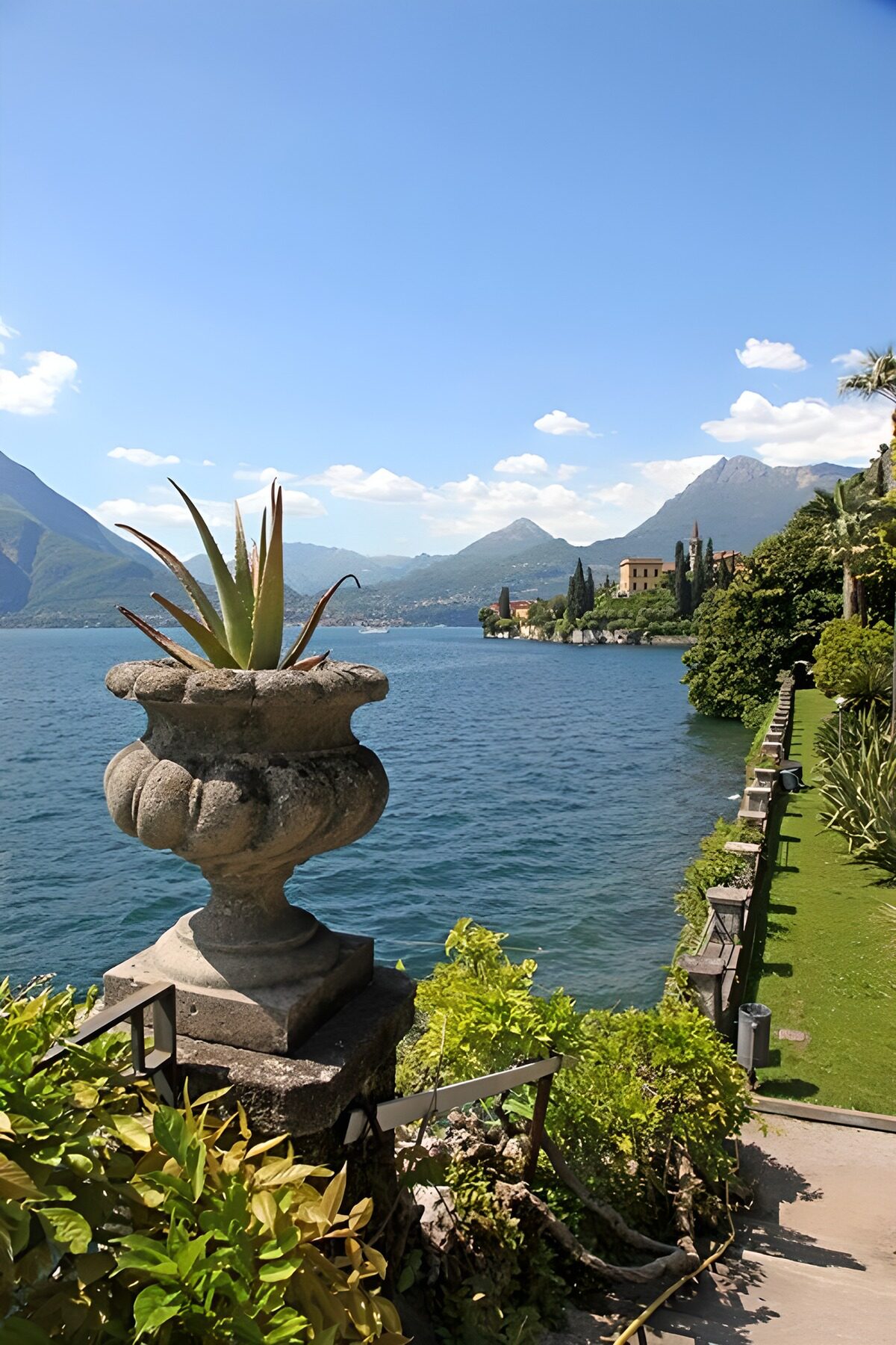 Sunlit lakeside garden and mountain views