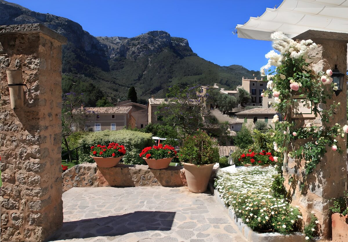Sunlit terrace with flowers and mountains