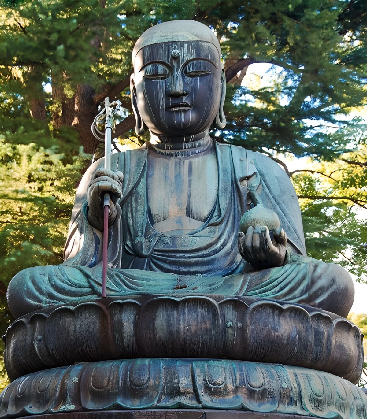 Seated Buddha in dappled shade