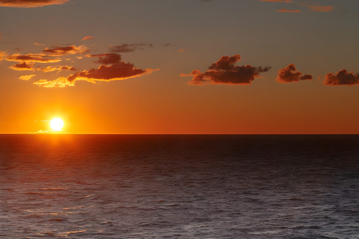 Low sun over a copper-coloured sea