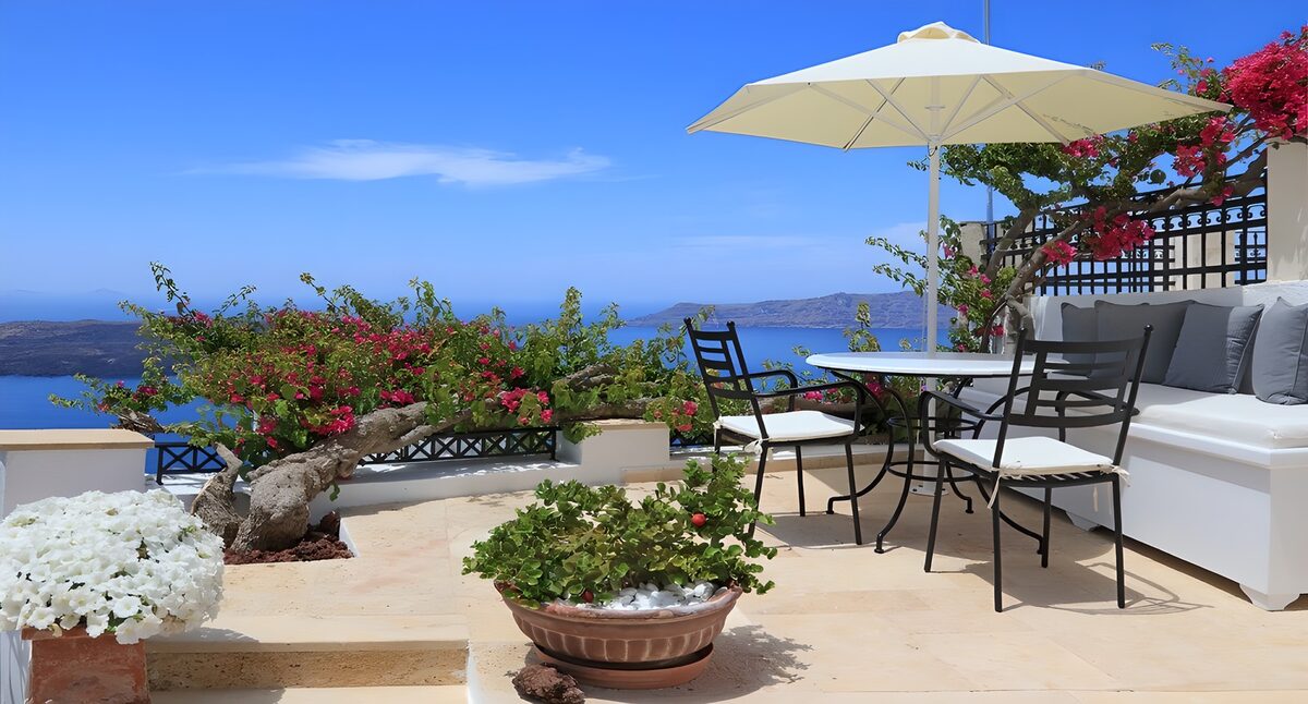 Sunlit terrace above a deep blue sea
