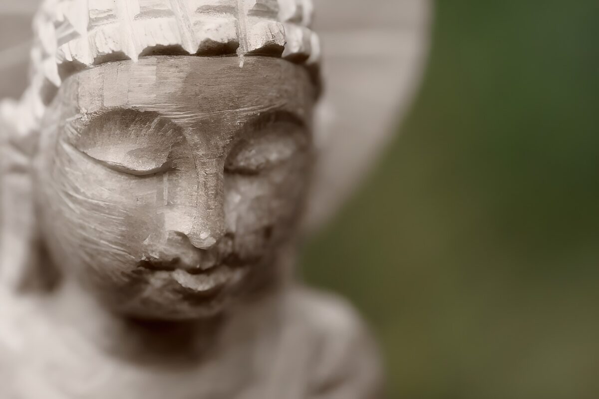 Wooden Buddha in soft light