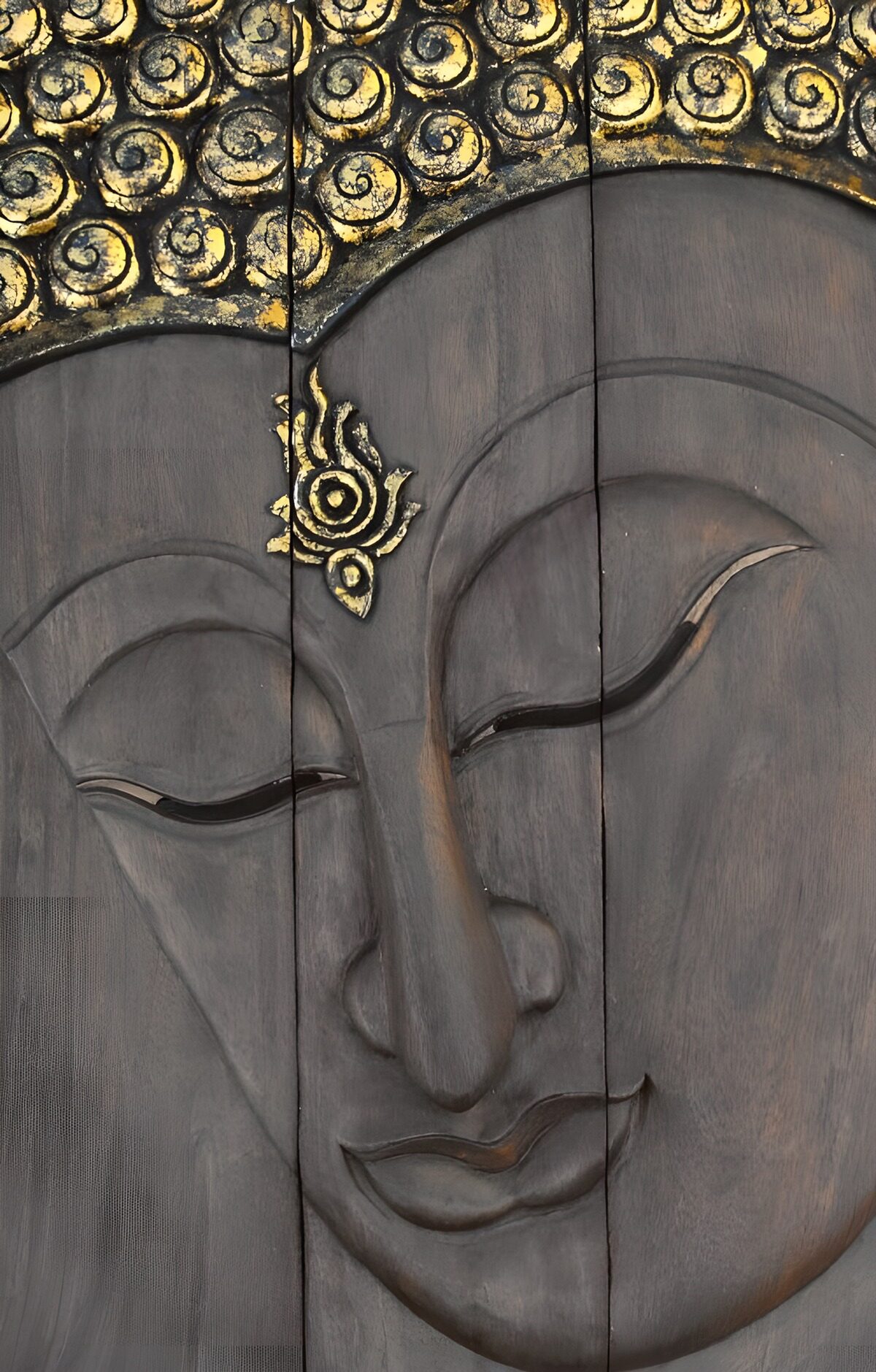 Carved wooden Buddha, eyes at rest