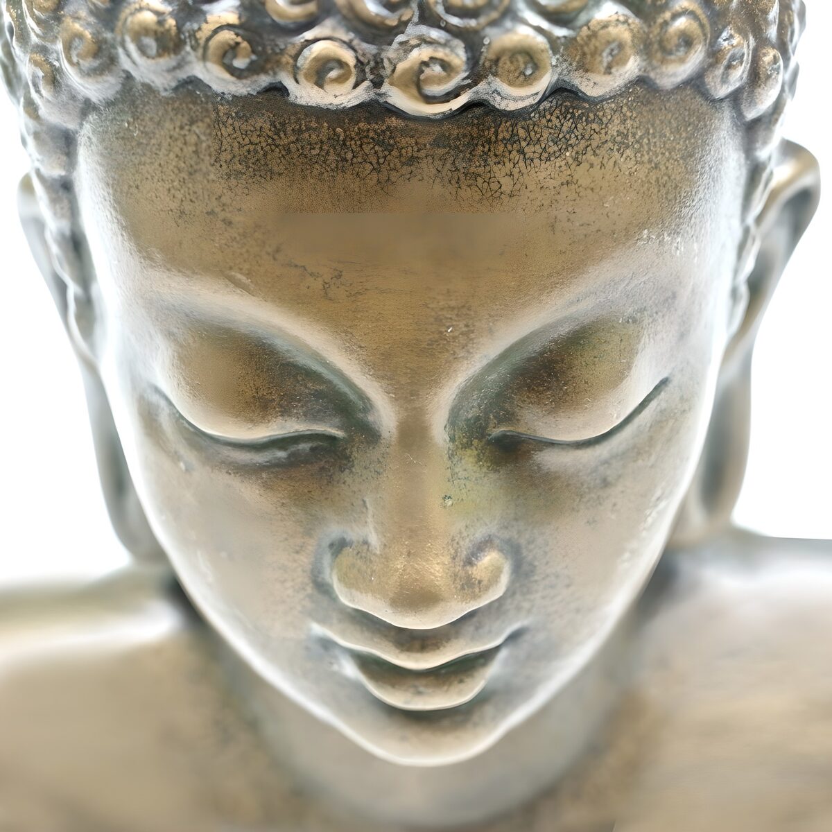 Golden Buddha face in quiet repose