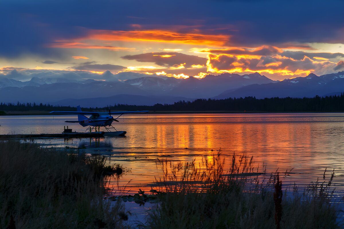 Floatplane at sunset on a mountain lake