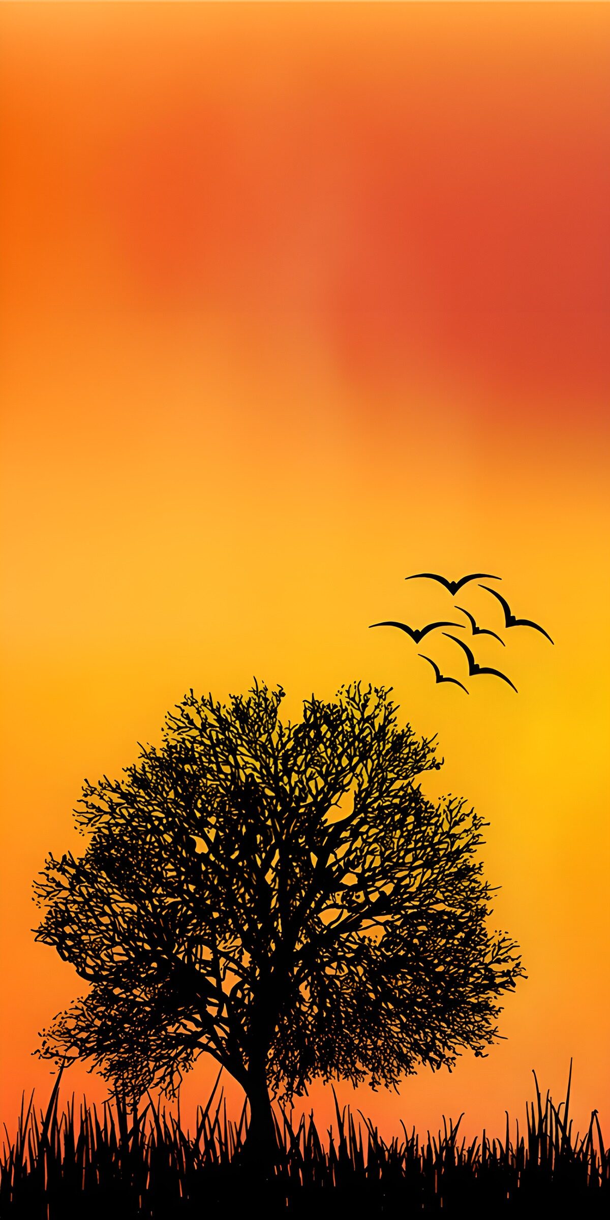 Tree and birds in a glowing sunset