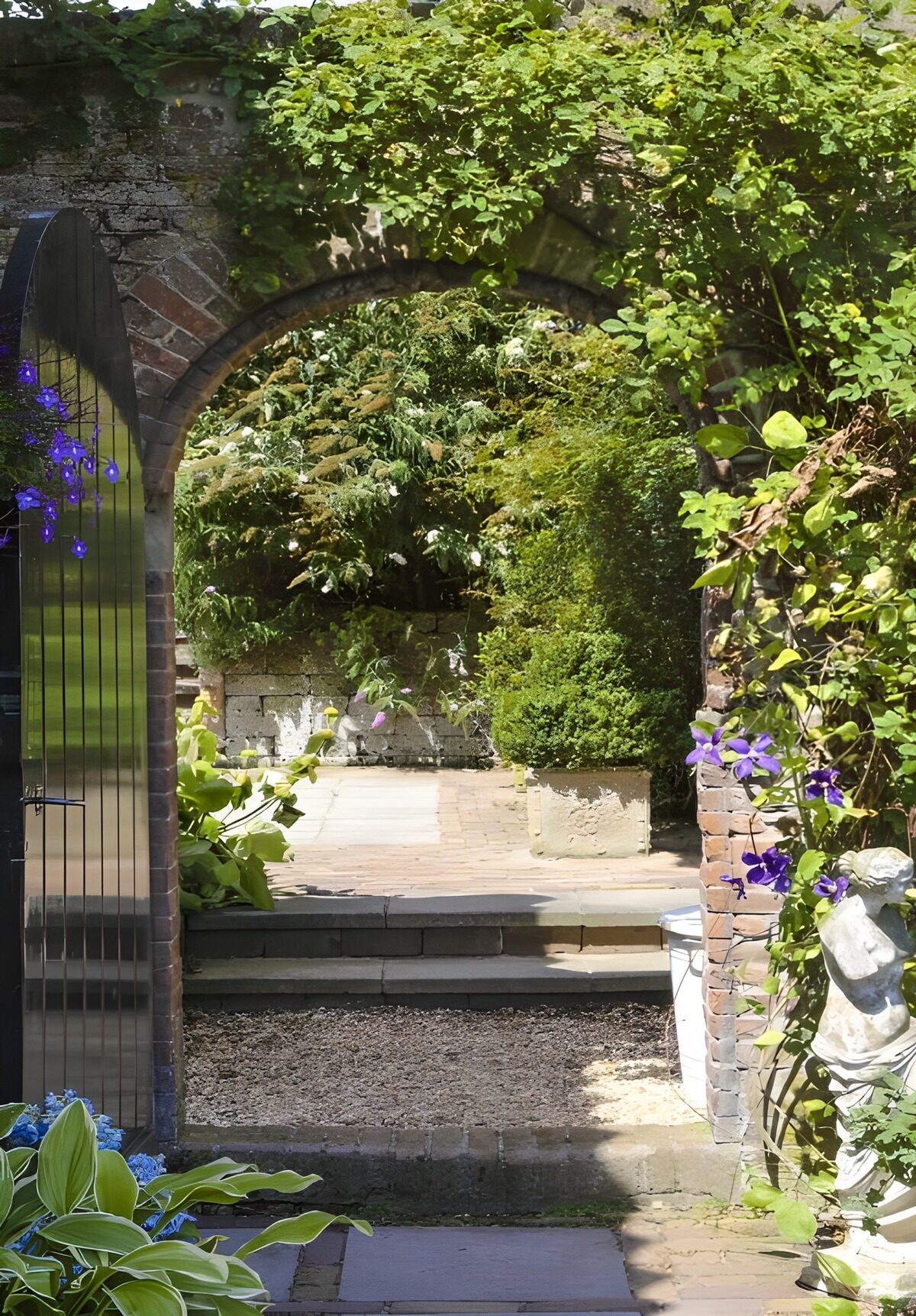 Stone arch into a sheltered garden