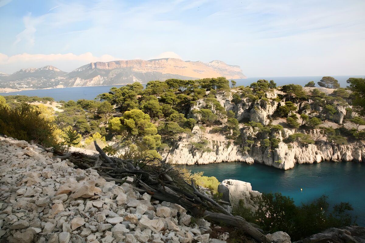 Sunlit cliffs above turquoise water
