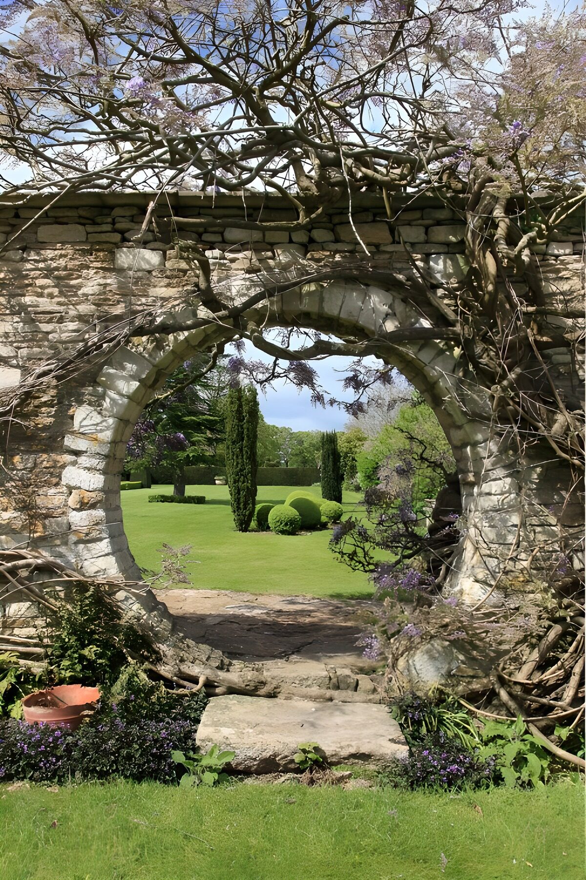 Spring tucked behind a stone arch