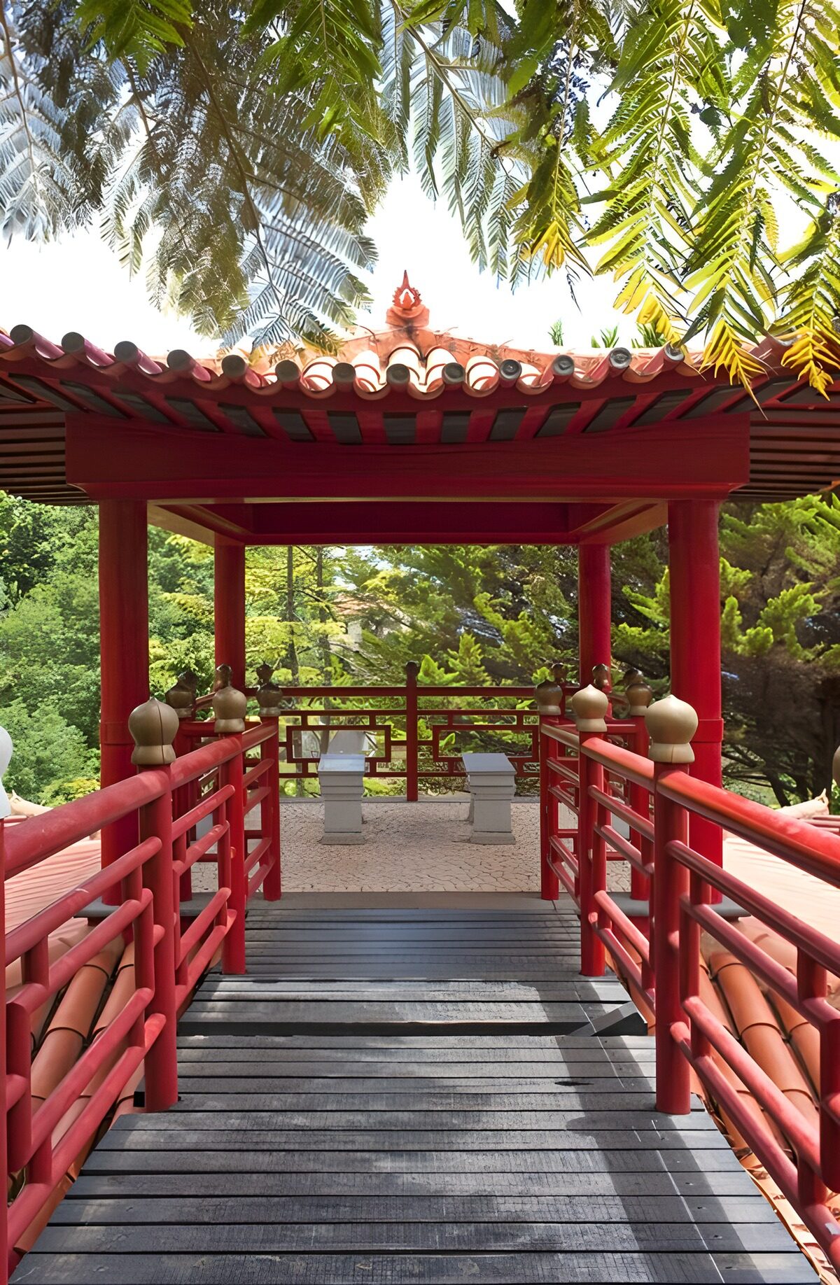 Red garden pavilion in dappled light