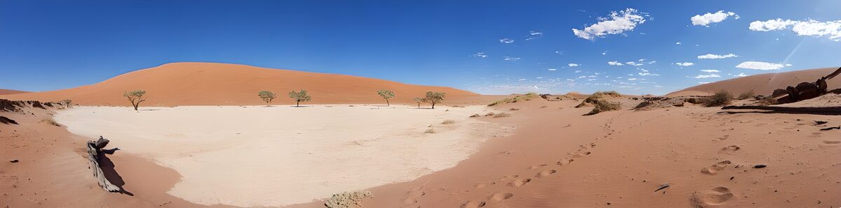 Orange dunes and a sunlit sandy basin