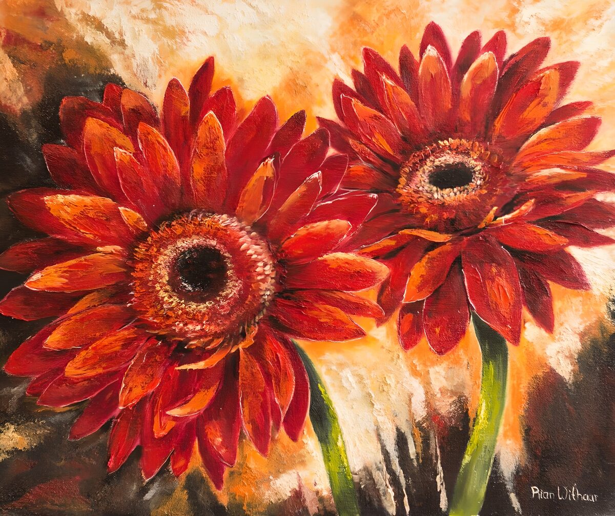 Red and orange gerberas in a warm glow