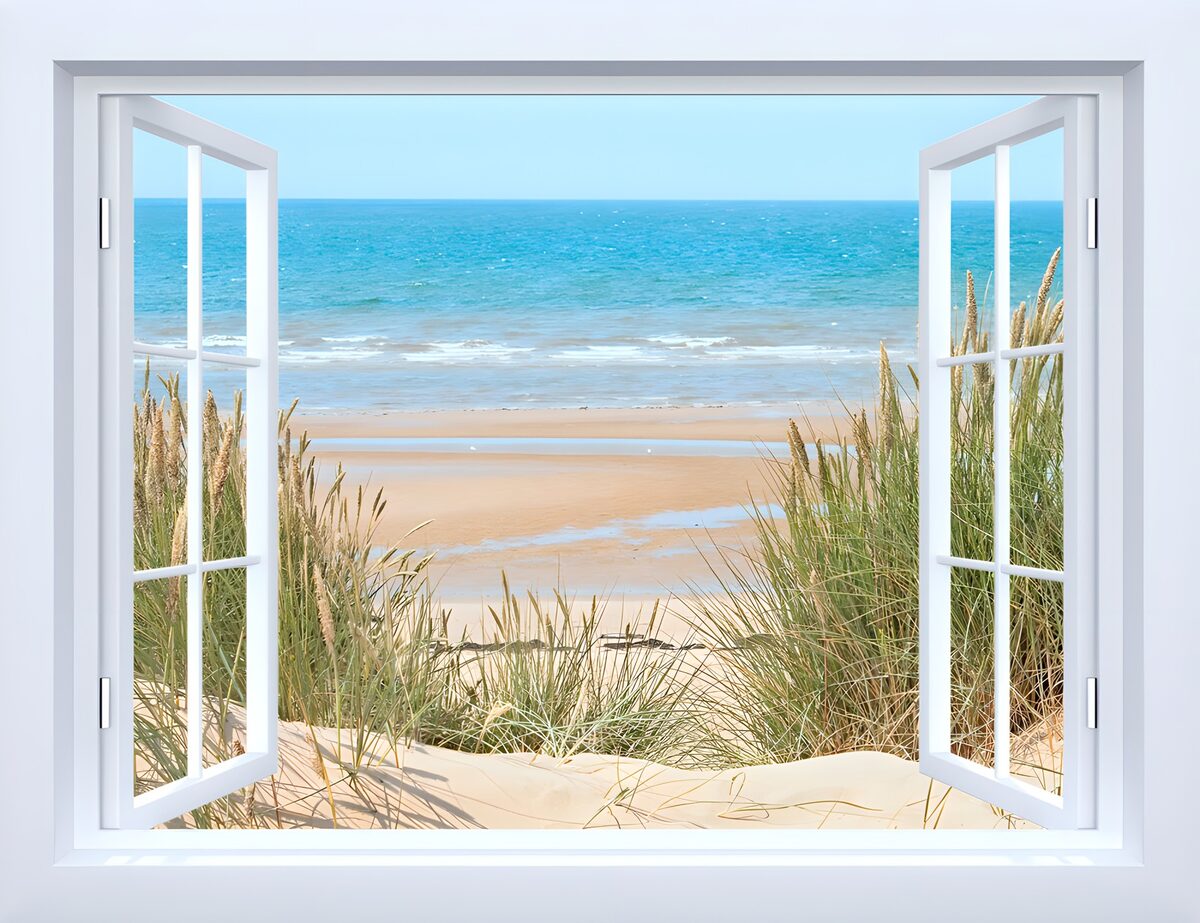 Open white window onto a sunlit beach