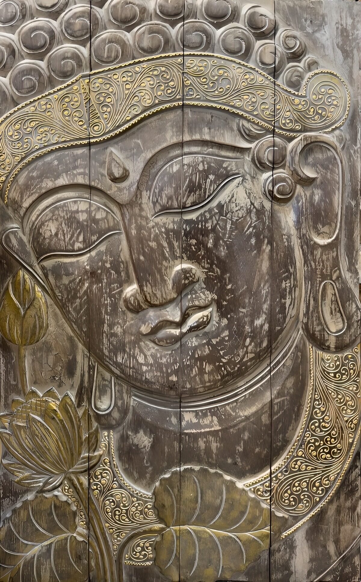 Carved Buddha with lotus flowers